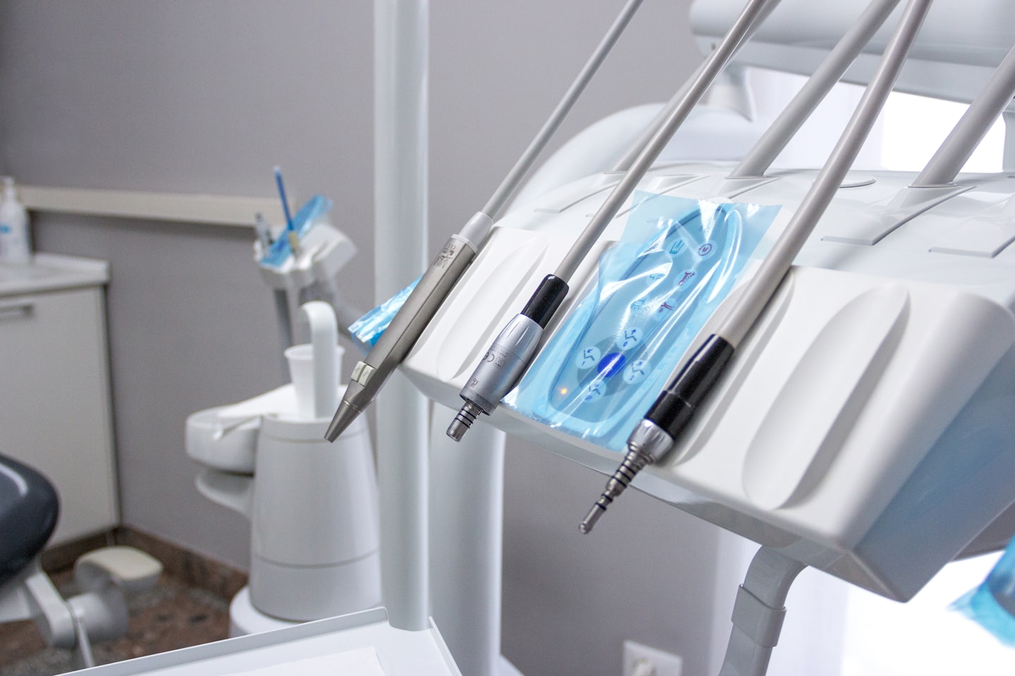 Sterile dental tools on a modern dental unit.